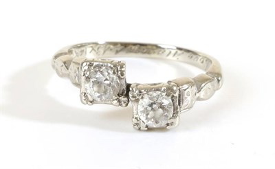 Lot 713 - A Diamond Two Stone Ring, old cut diamonds in square settings and stepped shoulders, to an...