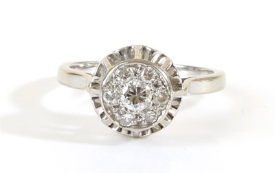 Lot 723 - A Diamond Cluster Ring, a circular plaque pav‚ set with round brilliant cut and eight-cut diamonds