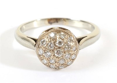 Lot 724 - A Diamond Cluster Ring, a circular domed top pav‚ set with round brilliant cut diamonds, to...