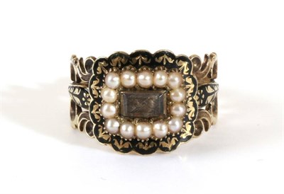 Lot 737 - A Georgian Mourning Ring, a central rectangular plaque containing hairwork, within a border of seed