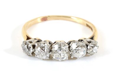 Lot 739 - A Diamond Five Stone Ring, graduated old cut diamonds in claw settings, to knife edge...