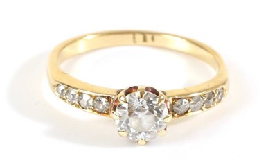 Lot 740 - A Solitaire Diamond Ring, an old cut diamond in a claw setting, to diamond set shoulders, principal