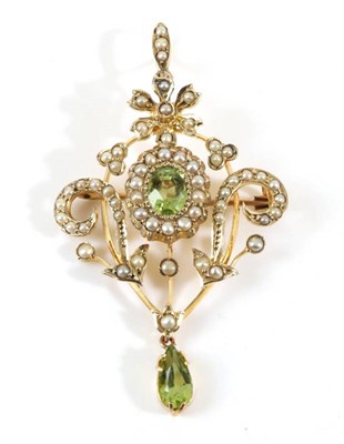 Lot 741 - An Edwardian Peridot and Seed Pearl Brooch/Pendant, an oval cut peridot within a border of seed...