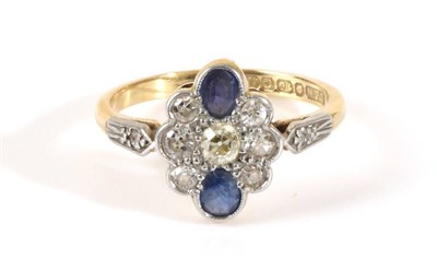 Lot 746 - An 18 Carat Gold Sapphire and Diamond Cluster Ring, a shaped plaque set with old cut diamonds...