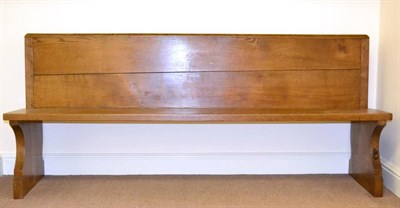 Lot 574 - A Robert  "Mouseman " Thompson Oak 6'1 " Pew, with book rest, on two shaped supports, with...