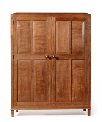 Lot 615 - An English Oak Wardrobe , designed by Gordon Russell, No.717, from the "Rissington" range, the...