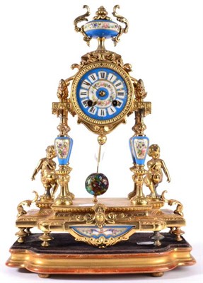 Lot 1210 - A Gilt Metal and Porcelain Mounted Striking Mantel Clock, circa 1890, surmounted by an urn...