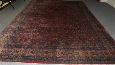 Lot 1254 - Indian Carpet, circa 1910 The raspberry field with an allover one way design of serrated...