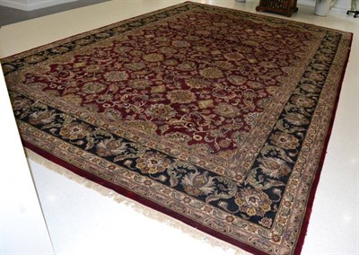 Lot 1256 - Agra Design Carpet India, modern The aubergine field with an allover design of columns of...