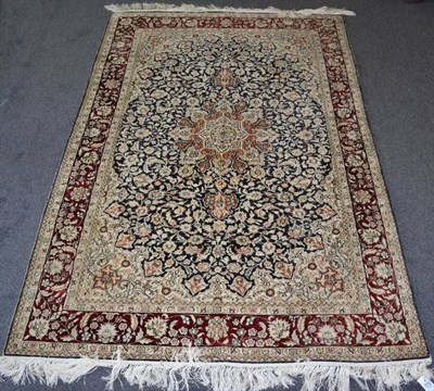 Lot 1257 - Chinese Silk Rug The field of flowering vines around a flowerhead medallion framed by spandrels and