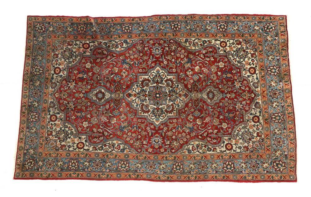 Lot 1263 - Ghom Rug Central Iran, circa 1950 The terracotta field of vines centred by an ivory medallion...