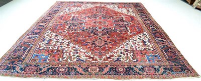 Lot 1273 - Heriz Carpet Iranian Azerbaijan, circa 1900 The terracotta field of angular vines centred by a...