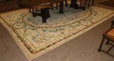 Lot 1289 - Modern Savonnerie Design Carpet The biscuit field with an oval panel centred by a floral spray, the