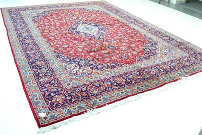 Lot 1293 - Kashan design carpet, circa 1960, possibly machine made The raspberry field with ivory and...
