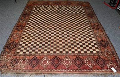 Lot 1304 - Rare Ersari Carpet North West Afghanistan, 19th century The chequered field enclosed by borders...