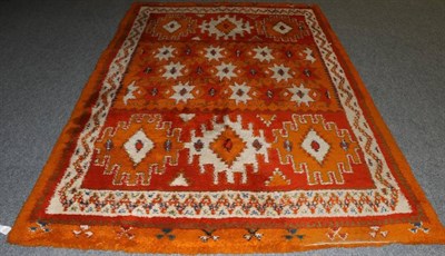 Lot 1318 - Berber Carpet Morocco, circa 1960 The compartmentalised field of hooked and stellar devices...