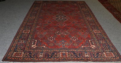 Lot 1323 - Joshaghan Carpet Central Iran, circa 1930 The brick red field of stylised plants around a...