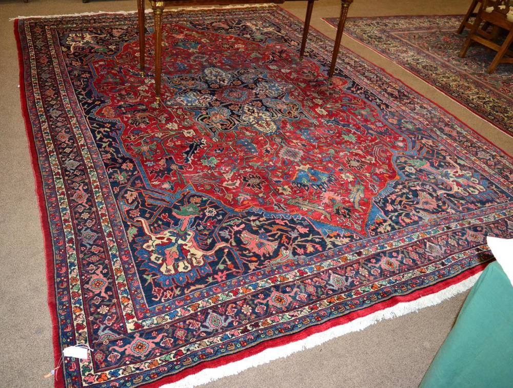 Lot 1326 - Bidjar Carpet Iranian Kurdistan, circa 1950 The strawberry field of angular vines around a...