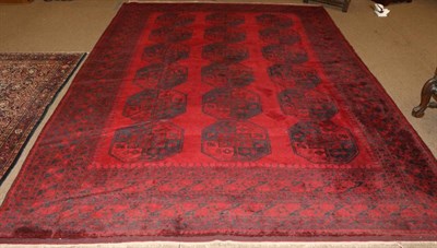 Lot 1330 - Turkmen Carpet North West Afghanistan, 20th century The crimson field with three rows of...