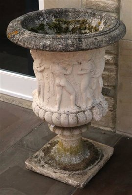 Lot 1337 - A Cast Stone Campana Urn, decorated in relief with classical figures on a fluted socle and...