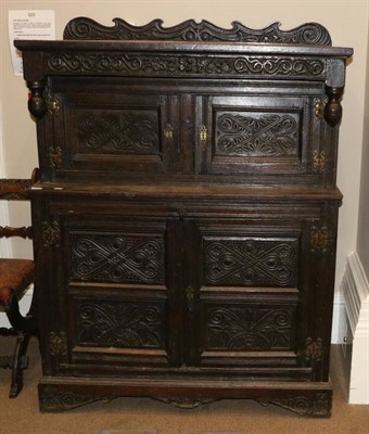 Lot 1344 - A Joined Oak Press Cupboard, initialled ASE and bearing date 1683, with carved frieze above...
