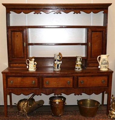 Lot 1346 - A George III Oak and Mahogany Crossbanded Dresser and Rack, early 19th century, the rack with three