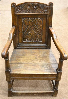 Lot 1348 - A 17th Century Joined Oak Wainscot Armchair, with carved top rail and back support above a...