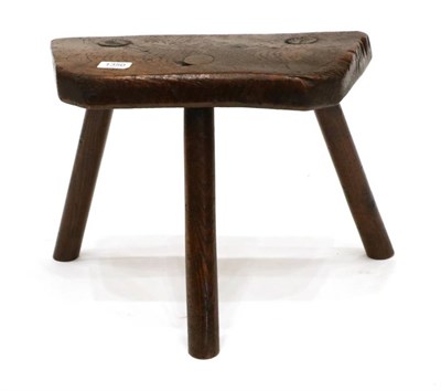 Lot 1350 - An Early 19th Century Elm Primitive Stool, on three splayed legs, 39cm by 30cm