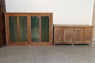 Lot 1355 - A Late 19th Century Glazed and Sliding Door Pine Cabinet, the interior lined in green fabric...