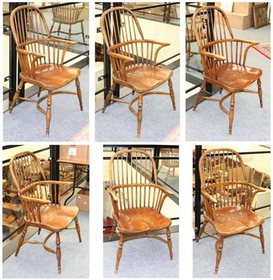 Lot 1361 - A Set of Six 20th Century Oak Yorkshire Style Windsor Armchairs, with double spindle back...