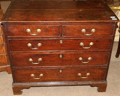 Lot 1362 - A George III Oak Straight Front Chest of Drawers, 3rd quarter 18th century, of two short over three