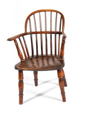 Lot 1371 - A Mid 19th Century Yewwood and Elm Seated Child's Windsor Armchair, with double spindle back...