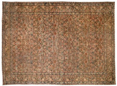 Lot 908 - Kirman Ravar Carpet South East Persia The pale sand field with an allover floral lattice...