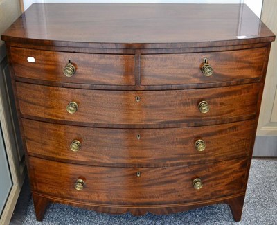 Lot 1404 - A Regency Mahogany Bowfront Chest of Drawers, early 19th century, of two short over three long...