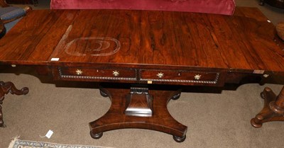 Lot 1408 - A Regency Rosewood Sofa Table, early 19th century, with two square drop leaves above two real...