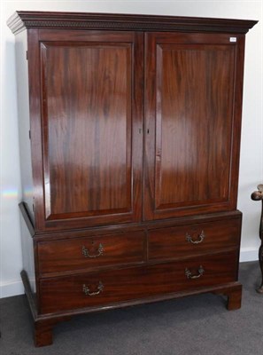 Lot 1409 - A George III Mahogany Dwarf Linen Press, 3rd quarter 18th century, with Greek Key cornice above...