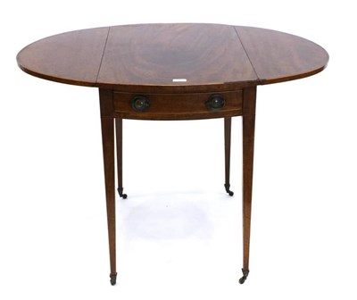 Lot 1425 - A George III Mahogany and Crossbanded Pembroke Table, circa 1800, with two rounded drop leaves...