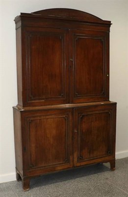 Lot 1426 - A Regency Mahogany Bookcase Cabinet, circa 1820, the architectural pediment above moulded...