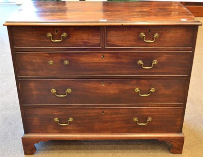 Lot 1427 - A George III Mahogany Straight Front Chest, circa 1800, with two short over three long drawers,...