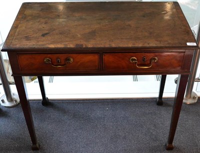 Lot 1435 - A George III Mahogany Side Table, late 18th century, the crossbanded top above two small frieze...