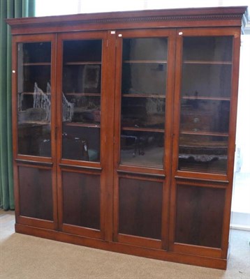 Lot 1439 - A Victorian Mahogany Glazed Bookcase, late 19th century, the moulded and dentil cornice above...