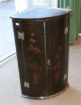 Lot 1443 - An 18th Century Bowfront Hanging Corner Cupboard, decorated in relief with Oriental figures in...