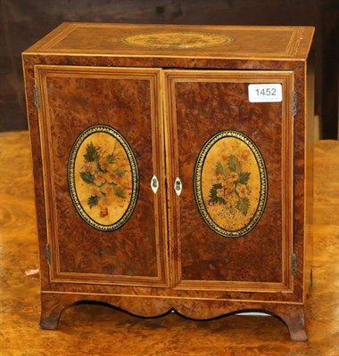 Lot 1452 - A 19th Century Amboyna and Crossbanded Collector's Chest, with hand embellished floral panels, twin