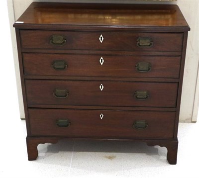 Lot 1460 - A George III Mahogany Straight Front Chest of Drawers, circa 1800, with moulded top above four...