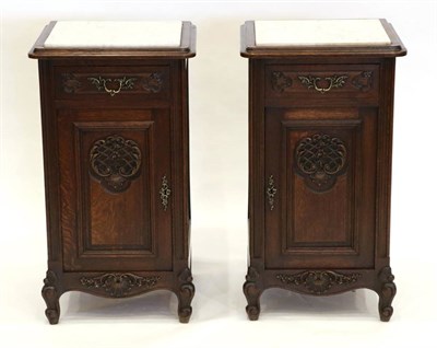Lot 1464 - A Pair of Late Victorian Oak Bedside Cupboards, late 19th century, with grey and white marble...