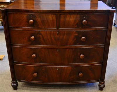 Lot 1471 - A Mahogany Bowfront Chest, circa 1820-30, of two short over three long drawers all between...