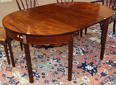 Lot 1480 - A George III Mahogany, Boxwood and Ebony Strung D Shape Dining Table, with one additional leaf,...