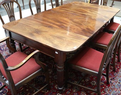 Lot 1483 - An Early 19th Century Mahogany Extending Dining Table, with two original additional leaves,...