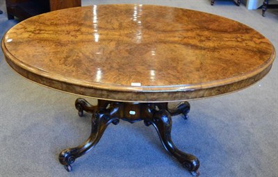 Lot 1486 - A Victorian Figured and Burr Walnut Flip-Top Oval Breakfast Table, circa 1860, the moulded edge...