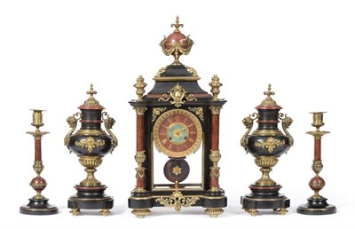 Lot 962 - An Unusual Five Piece Black Slate and Red Marble Striking Mantel Clock, circa 1870, elaborately...